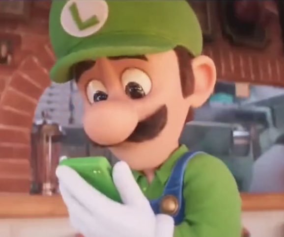Image of Luigi looking at his phone from the Mario movie.