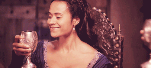 Animated gif of Gwen from Merlin drinking from a goblet