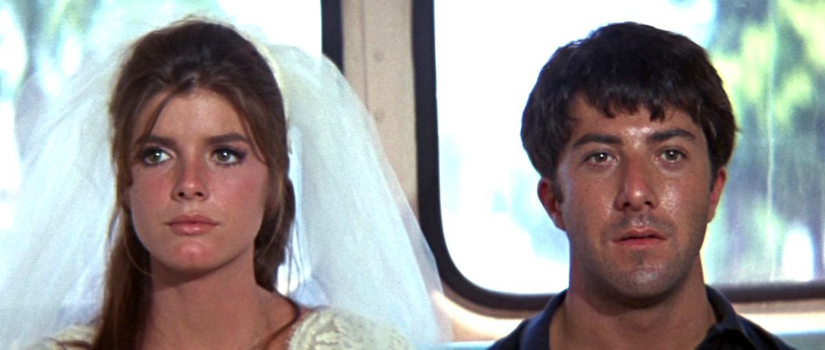 Shot from the final scene of The Graduate featuring Katherine Ross in a bridal gown and veil sitting beside Dustin Hoffmann, both looking dazed.