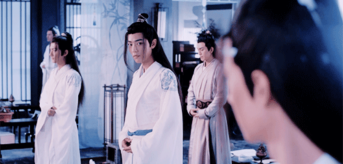 Animated gif of Wei Wuxian from MDZS smiling and waving.