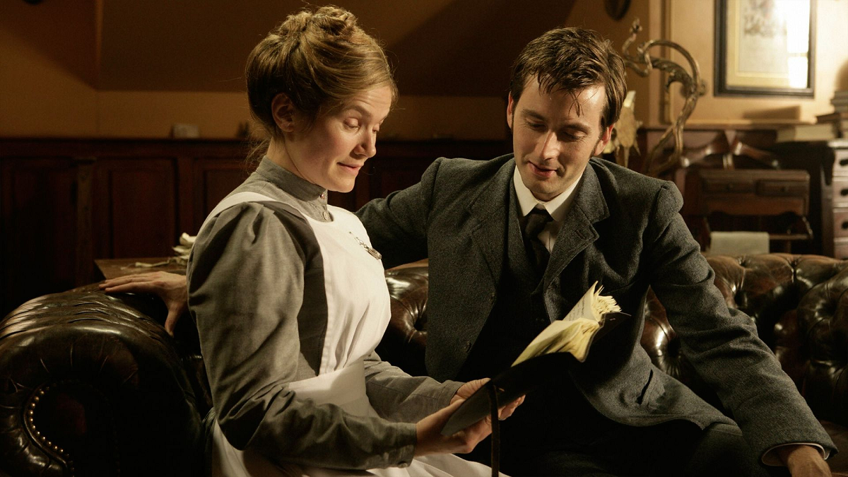 Still image of Joan and the 10th Doctor from "Human Nature" reading the Doctor's journal