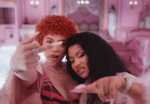 Animated gif of Ice Spice and Nikki Minaj giving the camera the finger in the Princess Diana video