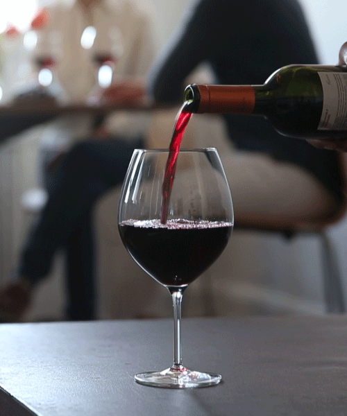  An animated gif of red wine being poured into a glass. 