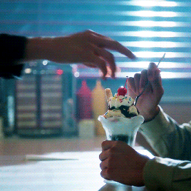  An animated gif in which Jughead Jones, on  Riverdale , takes a maraschino cherry off the top of someone else’s sundae and insolently eats it. 