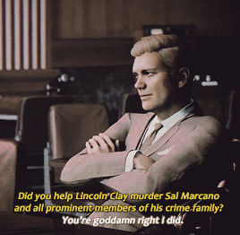  An animated gif of a character from  Mafia 3 , a white man in a business suit with his arms insolently crossed. The caption is: “Did you help Lincoln Clay murder Sal Marcano and all prominent members of his crime family?” “You’re goddamn right I did.” 