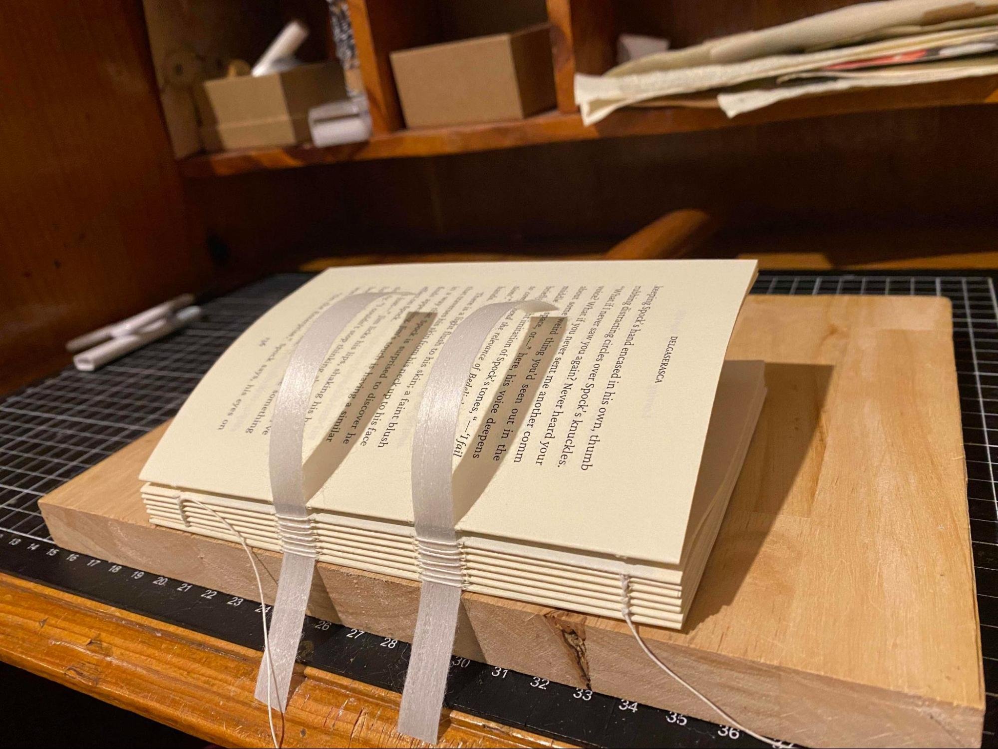 Image of a book being bound