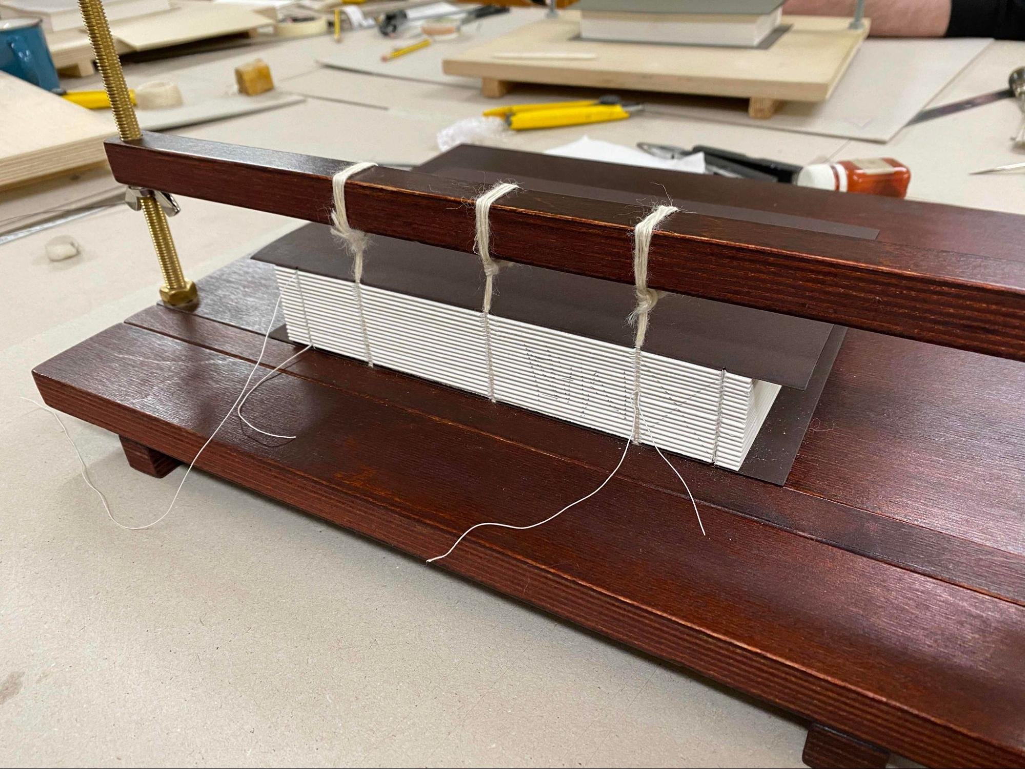 Image of a book being sewn