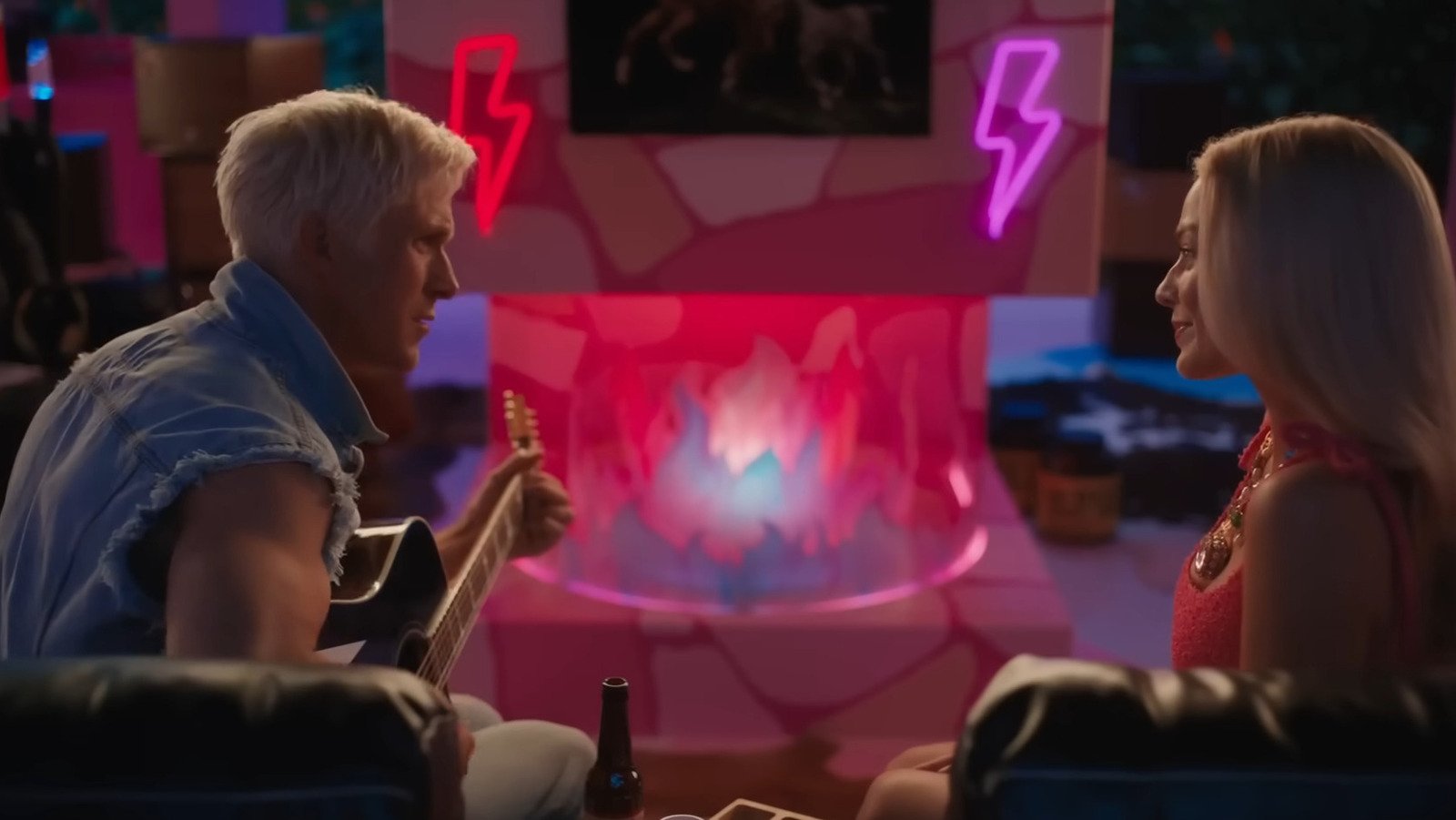 Still image of Ken playing his guitar at Barbie in the Barbie movie