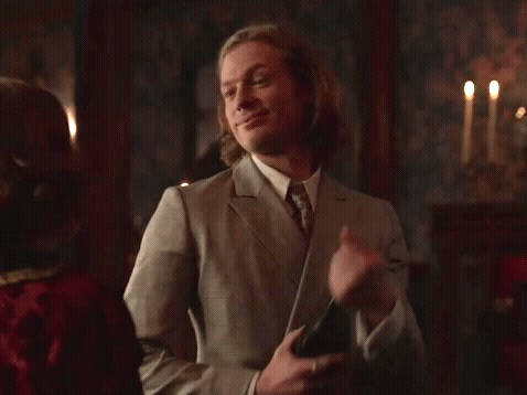 Animated gif of Lestat popping champagne suggestively.