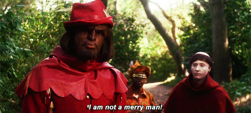 Animated gif of Worf, Data, and Geordi from Star Trek TNG in Robin Hood costumes. Captions with Worf's dialogue: I am not a merry man!