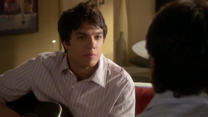 Elizabeth's former neighbor Chris Riggi on Gossip Girl, holding a guitar