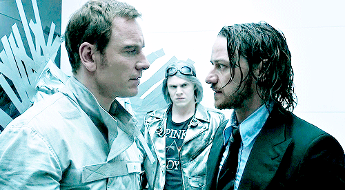 Animated gif of Erik and Charles glaring at each other while Peter looks on skeptically.