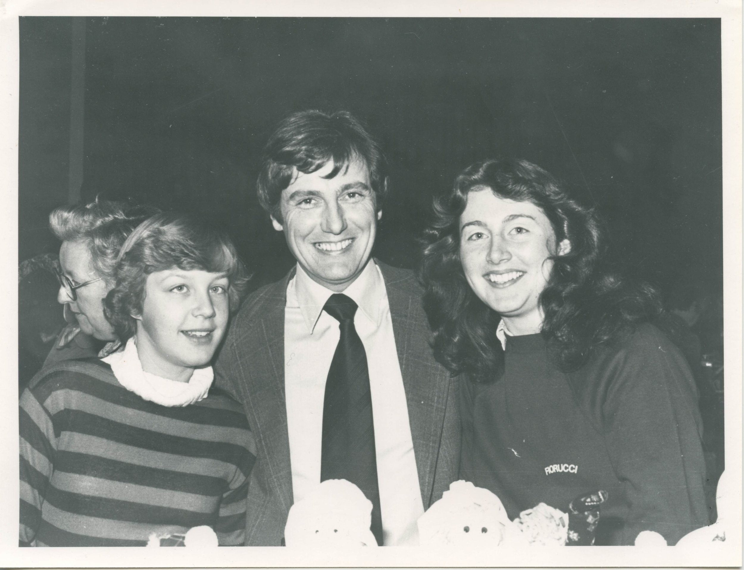 B&W photo of Paul Darrow and two fans.