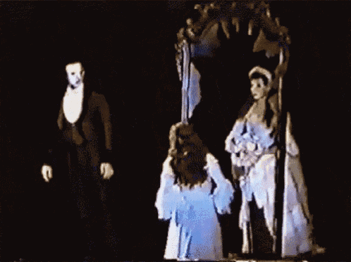 Animated gif from a stage production of Phantom depicting Christine fainting