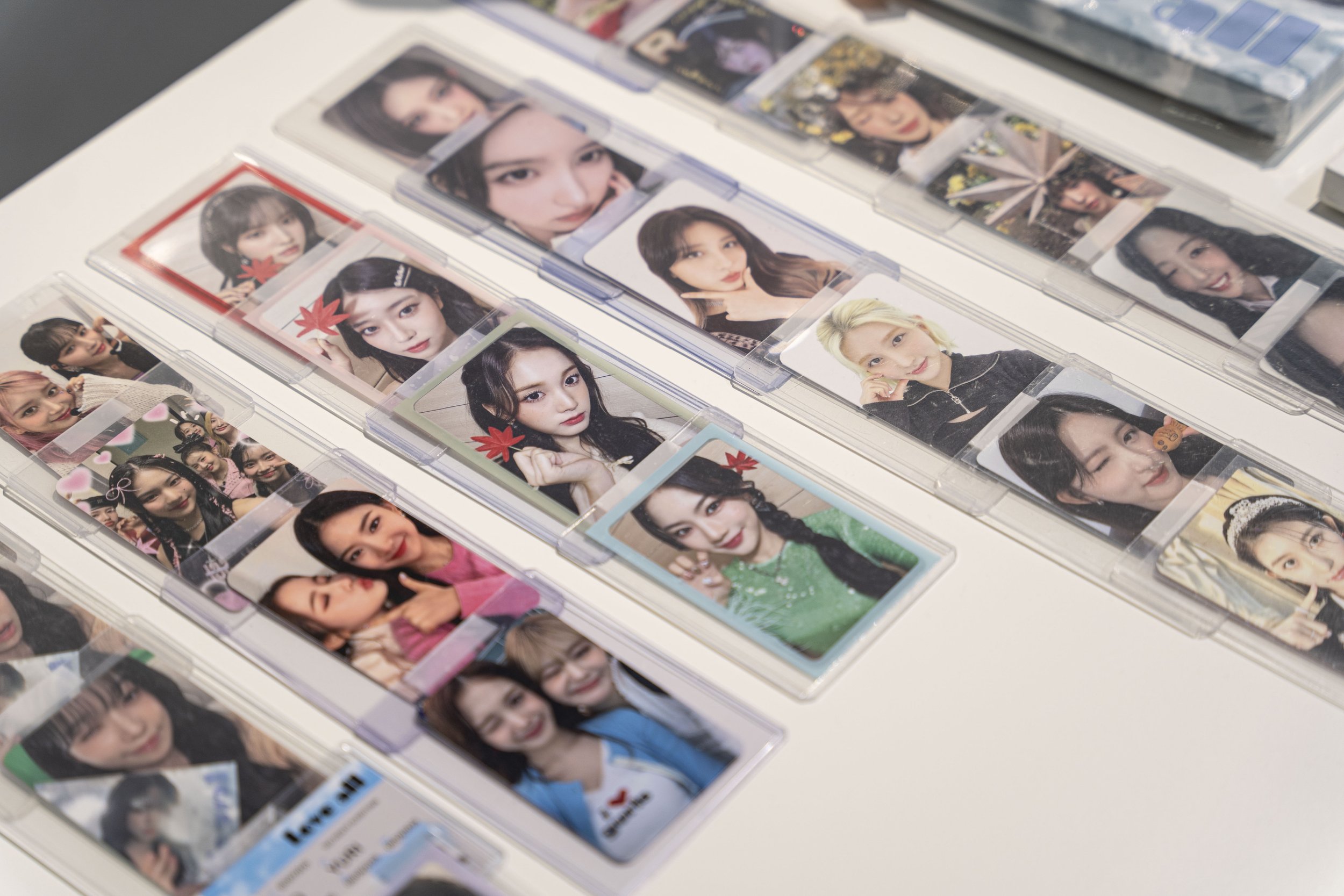 Several rows of photo cards laid out on a table.