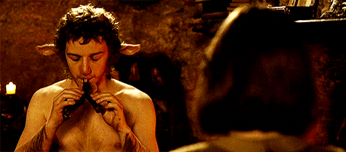 Animated gif of James McAvoy as Mr Tumnus playing a flute