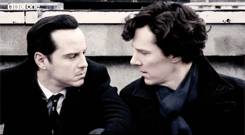 Animated gif of Sherlock and Moriarity leaning in close like they are about to kiss