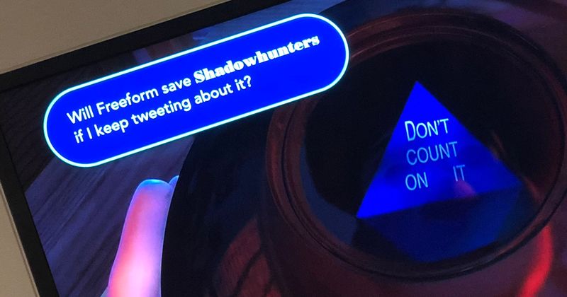  A screenshot of a television: a pop up asks “Will Freeform save Shadowhunters if I keep tweeting about it?” The magic 8-ball on the screen reads “Don’t count on it.” 