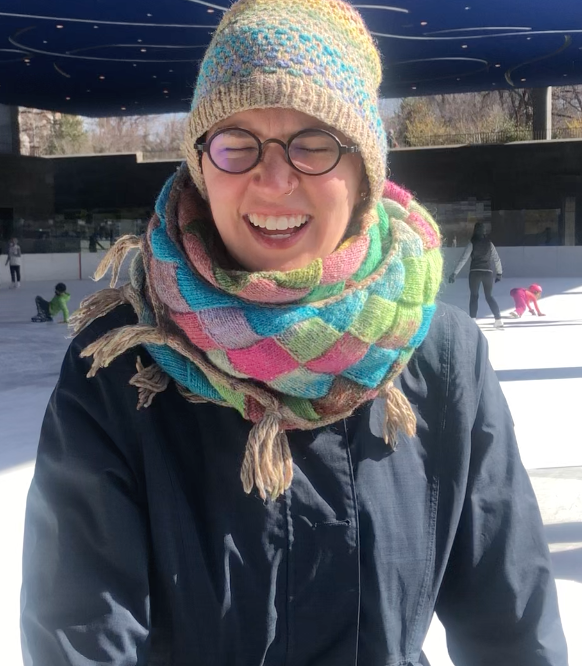 Photograph of Flourish in a knitted winter hat and scarf
