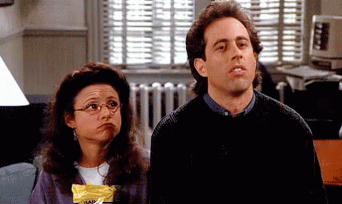 Animated gif of Elaine and Jerry from Seinfeld shrugging