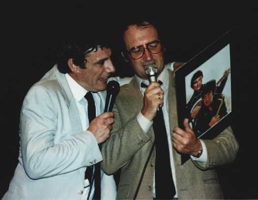 Photo of Darrow and Keating looking at fanart