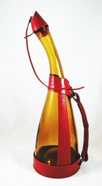 Photograph of a bottle from Star Trek with amber-colored glass and red trim