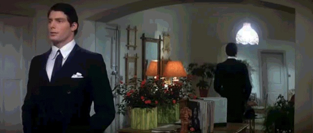 Animated gif of Superman putting on his glasses