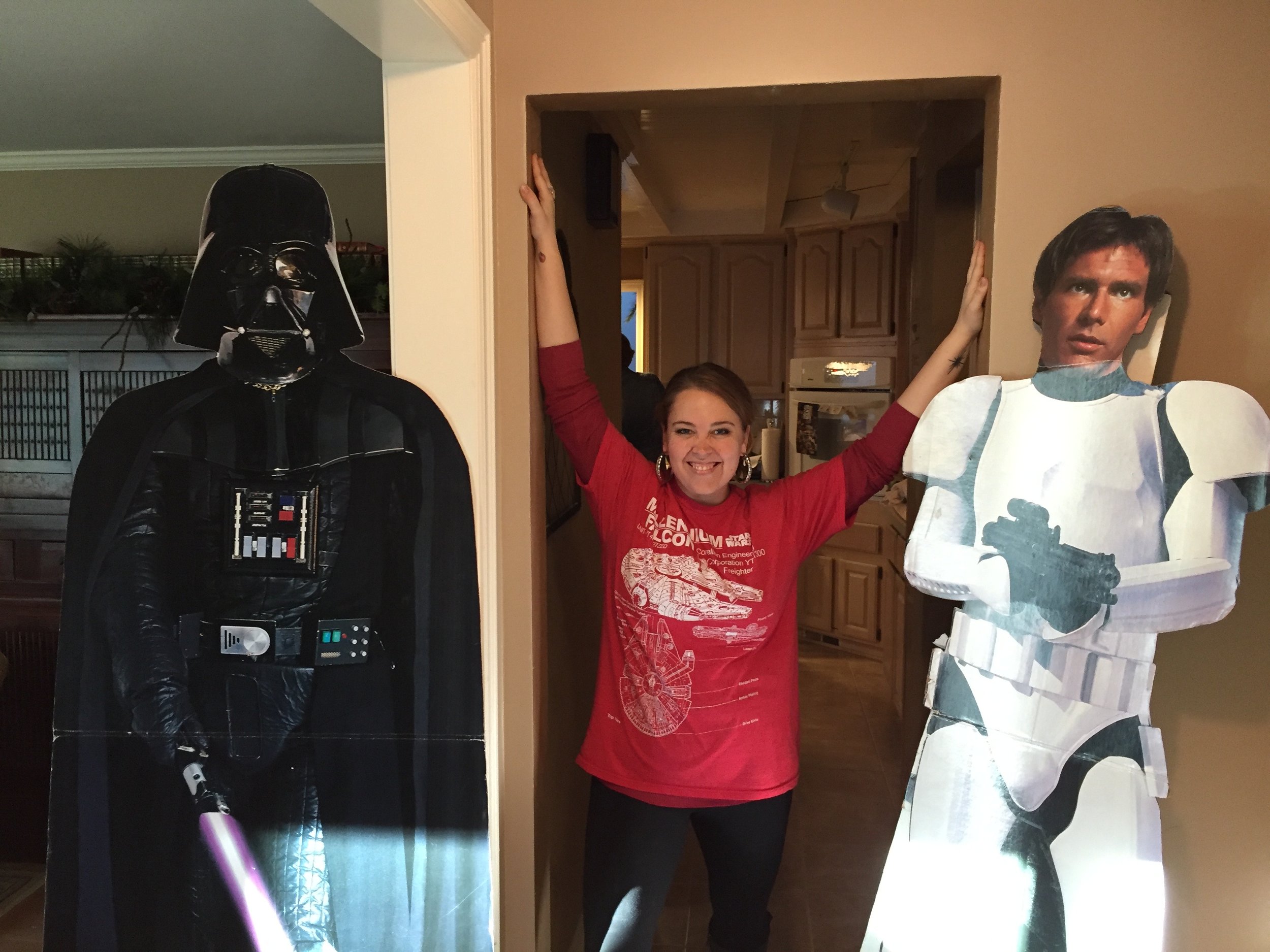 Photo of Tessa with Darth Vader and Han Solo standees.