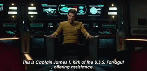 Animated gif zooming in on Kirk with the caption "This is Captain James T Kirk of the USS Farragut offering assistance."