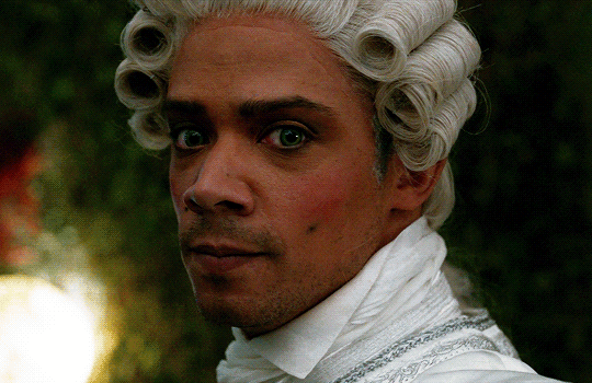 Animated gif of Louis from IWTV in eighteenth century costume, gazing at the camera while dancing