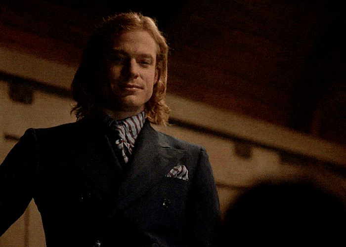 Animated gif of Lestat cocking his head and raising an arm