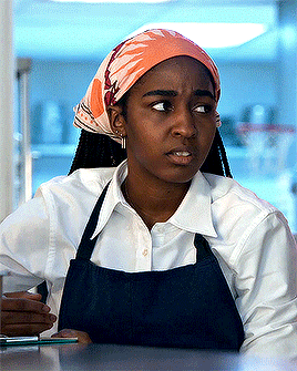 Animated gif of Sydney from The Bear, looking annoyed