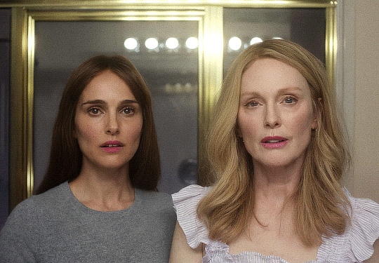 Animated gif of the scene from May December where Natalie Portman and Julianne Moore stand side by side looking in a mirror