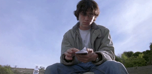 Animated gif of Joseph Gordon-Levitt in Brick, flipping through papers