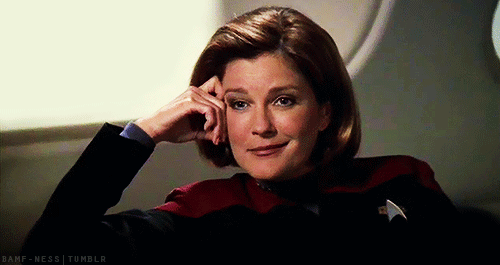 Animated gif of Captain Janeway (Kate Mulgrew) from Star Trek Voyager smirking