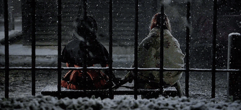 Animated gif of Max and Anne from Black Sails holding hands in the snow