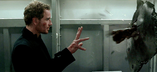 Animated gif of Erik in Dark Phoenix using his powers to manipulate an attacker whose arm is surrounded with metal.