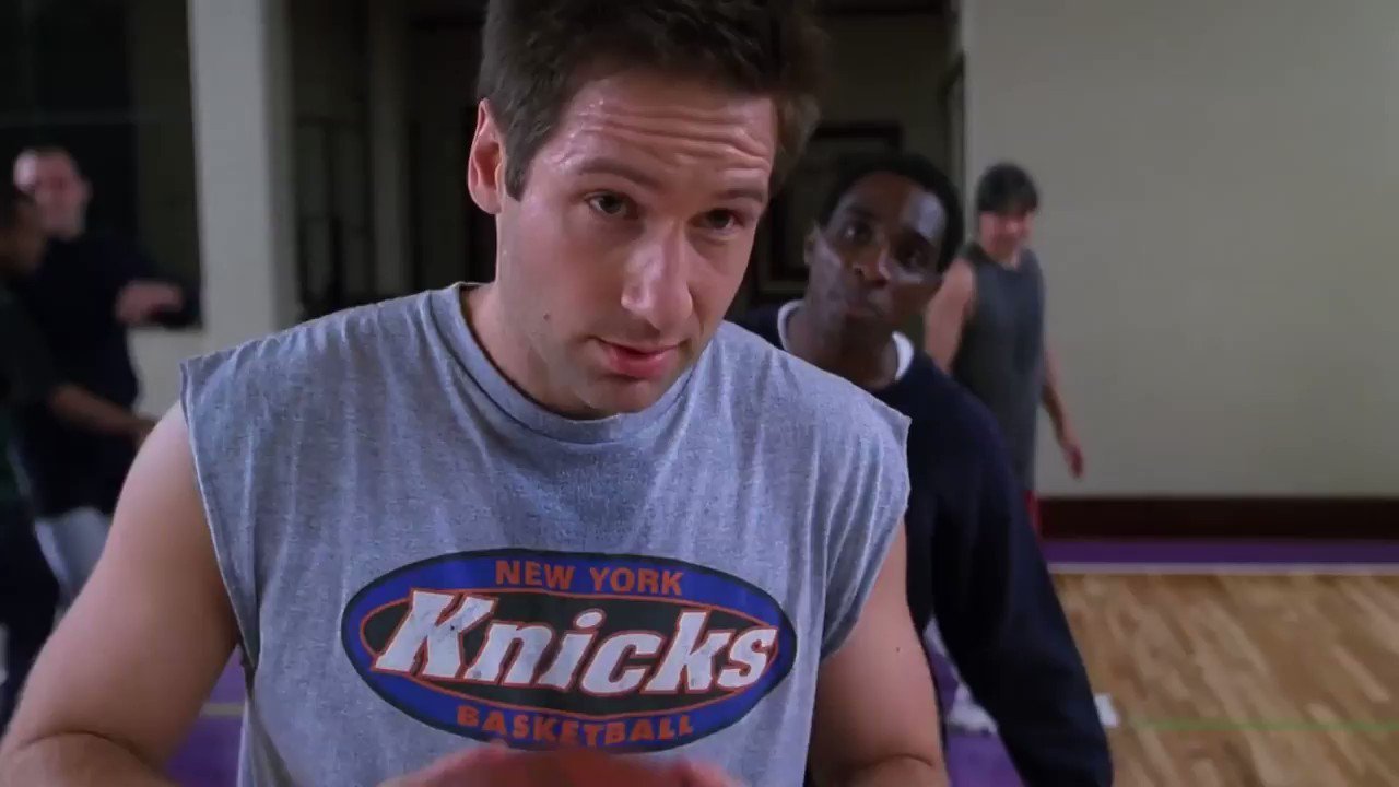 Screengrab of Mulder wearing a Knicks shirt.
