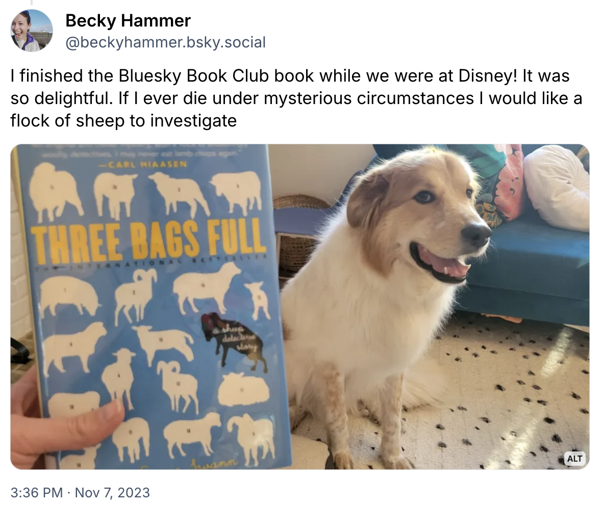 Image of the book and a dog. Caption: "I finished the Bluesky Book Club book while we were at Disney! It was so delightful. If I ever die under mysterious circumstances I would like a flock of sheep to investigate.