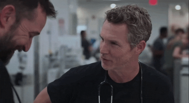 Animated gif of Drs Robby and Abbott smiling at each other.
