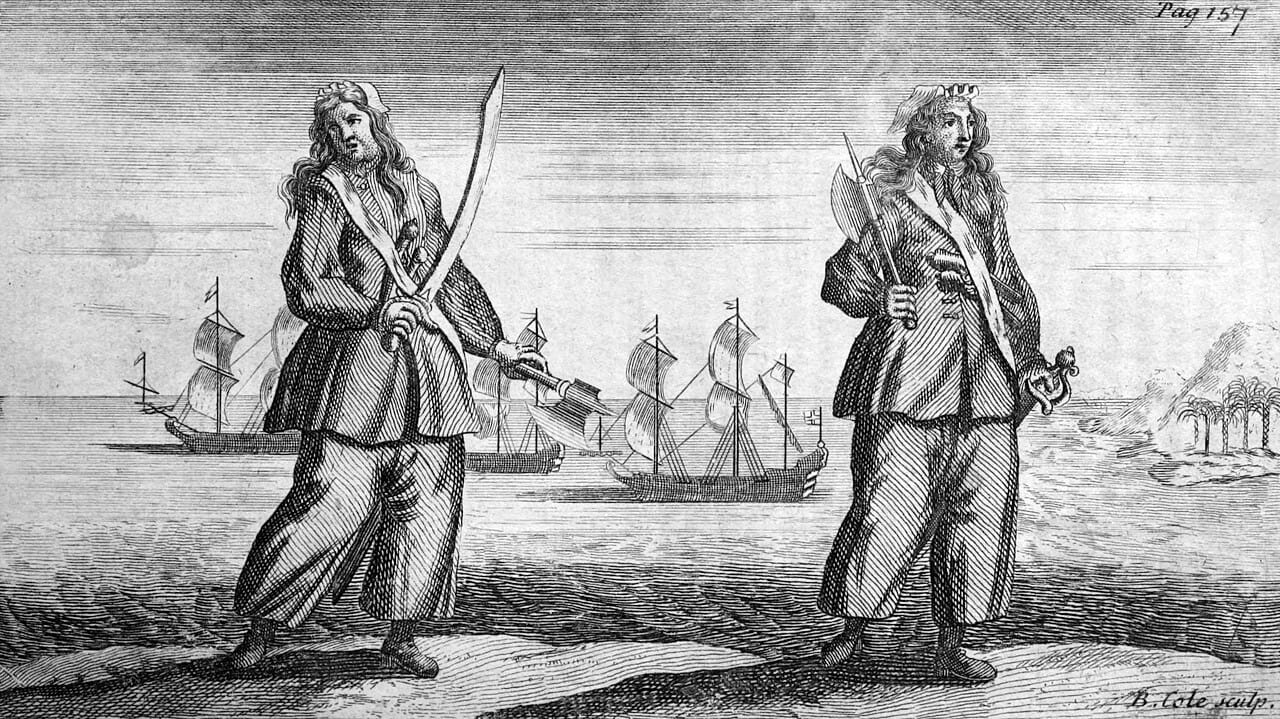 Woodcut drawing of Anne and Mary, both holding swords and in front of several sailing ships.