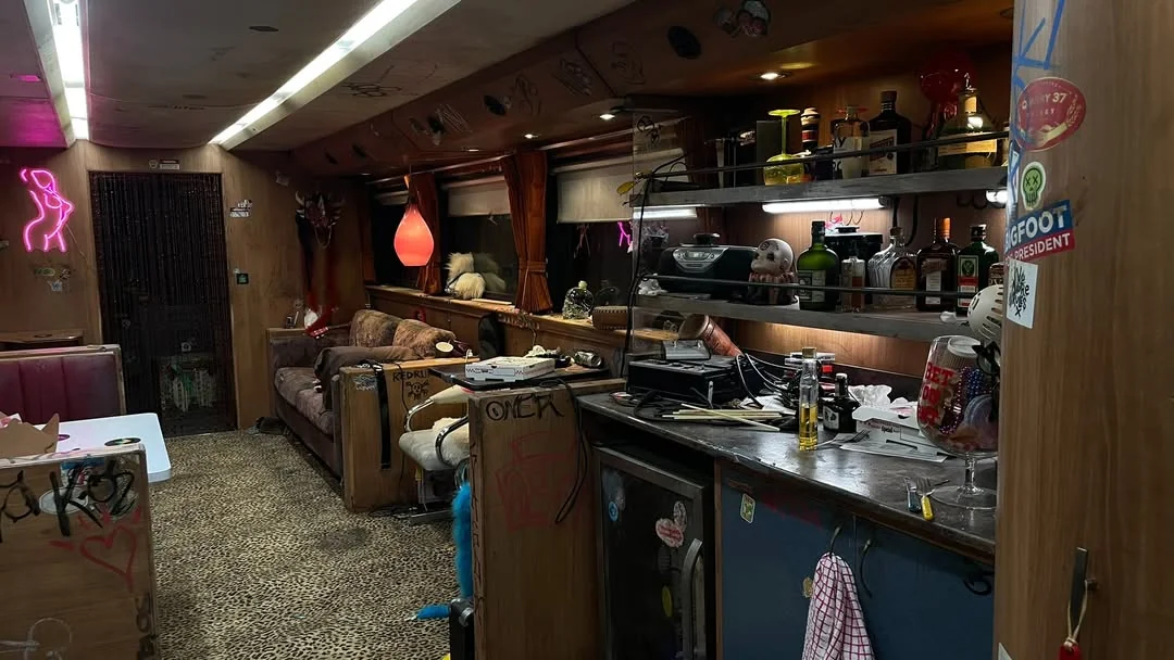 Image from TVL featuring the clutter on the tour bus.