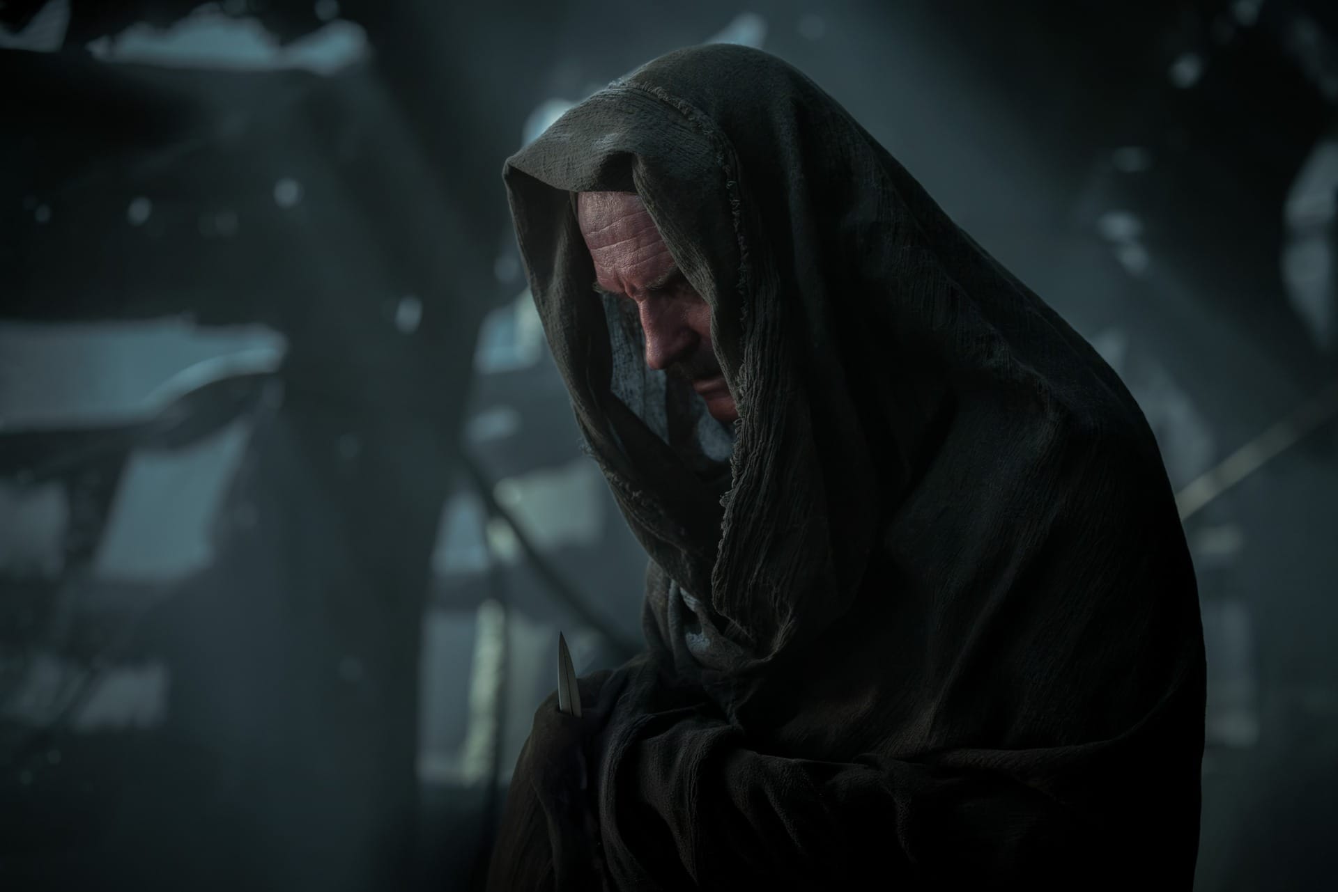 Production still featuring Sinestro in a hooded outfit, in shades of grey.