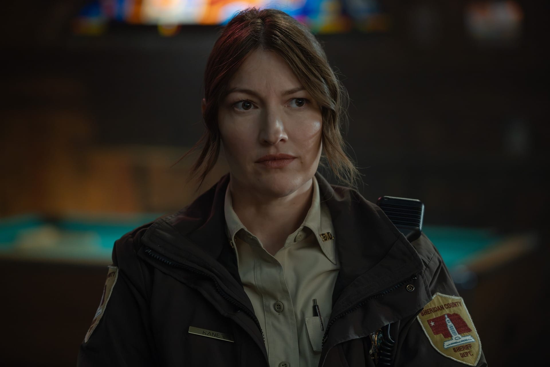 Production still of Kerry in her sheriff's uniform