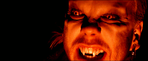 Animated gif of David all vamped up with a ridged brow and cheeks and protruding fangs.