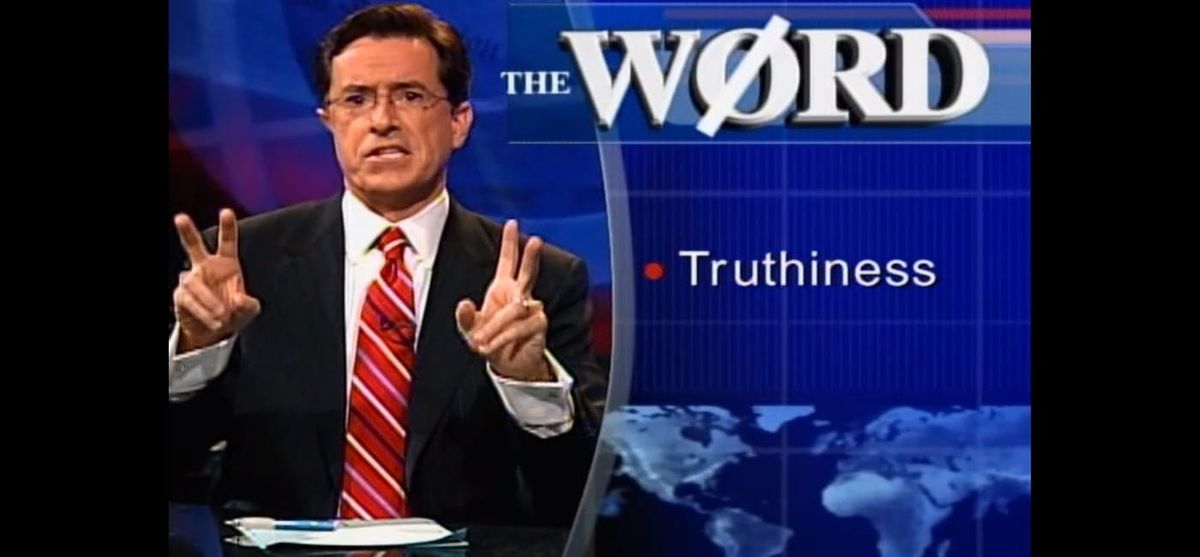 Screenshot of Stephen Colbert on the first episode of The Colbert Report during his "The Word" segment, fingers raised in air quotes as the caption "Truthiness" appears onscreen.