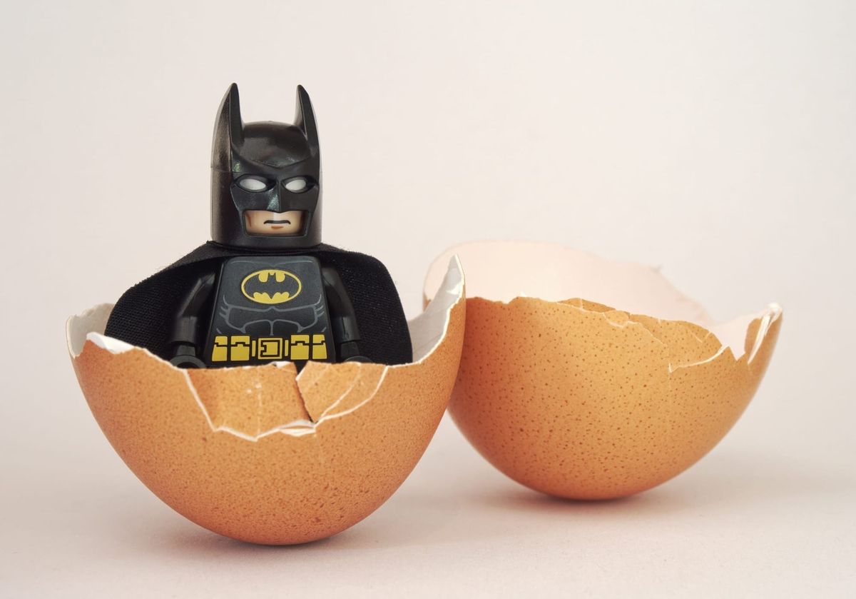  A Batman lego toy hatches out of an egg. 