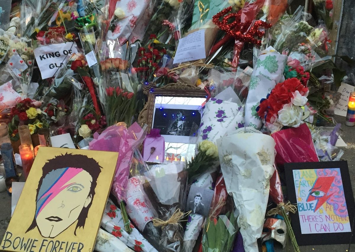 Flowers and gifts piled in memory of David Bowie. 