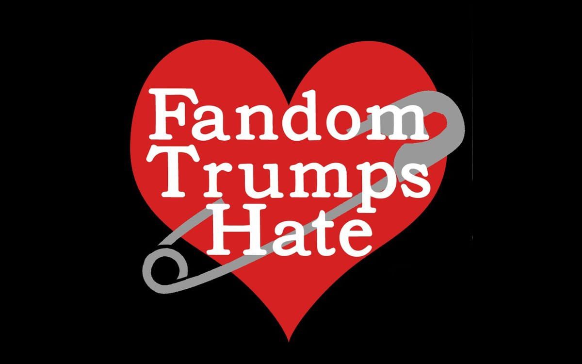 The Fandom Trumps Hate logo, a heart with a safety pin through it. 