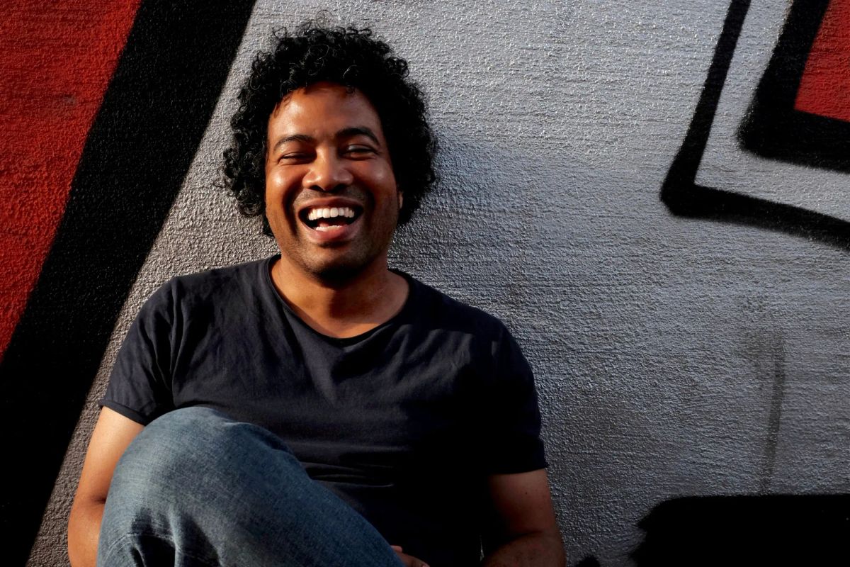 A photograph of Kenyatta Cheese, laughing. 